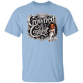 A light blue short-sleeve crewneck t-shirt featuring a graphic print on the front with the words 'Crowned & Confident' in ornate silver lettering, topped with a crown, and accompanied by an illustration of a woman in a white outfit.