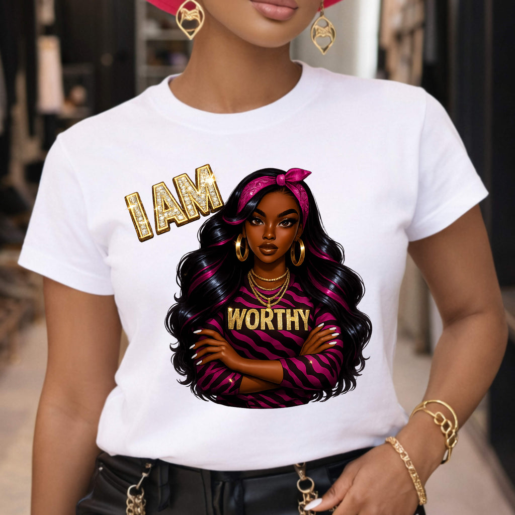 Person wearing a white t-shirt with an illustration of a woman and 'I AM WORTHY' text.