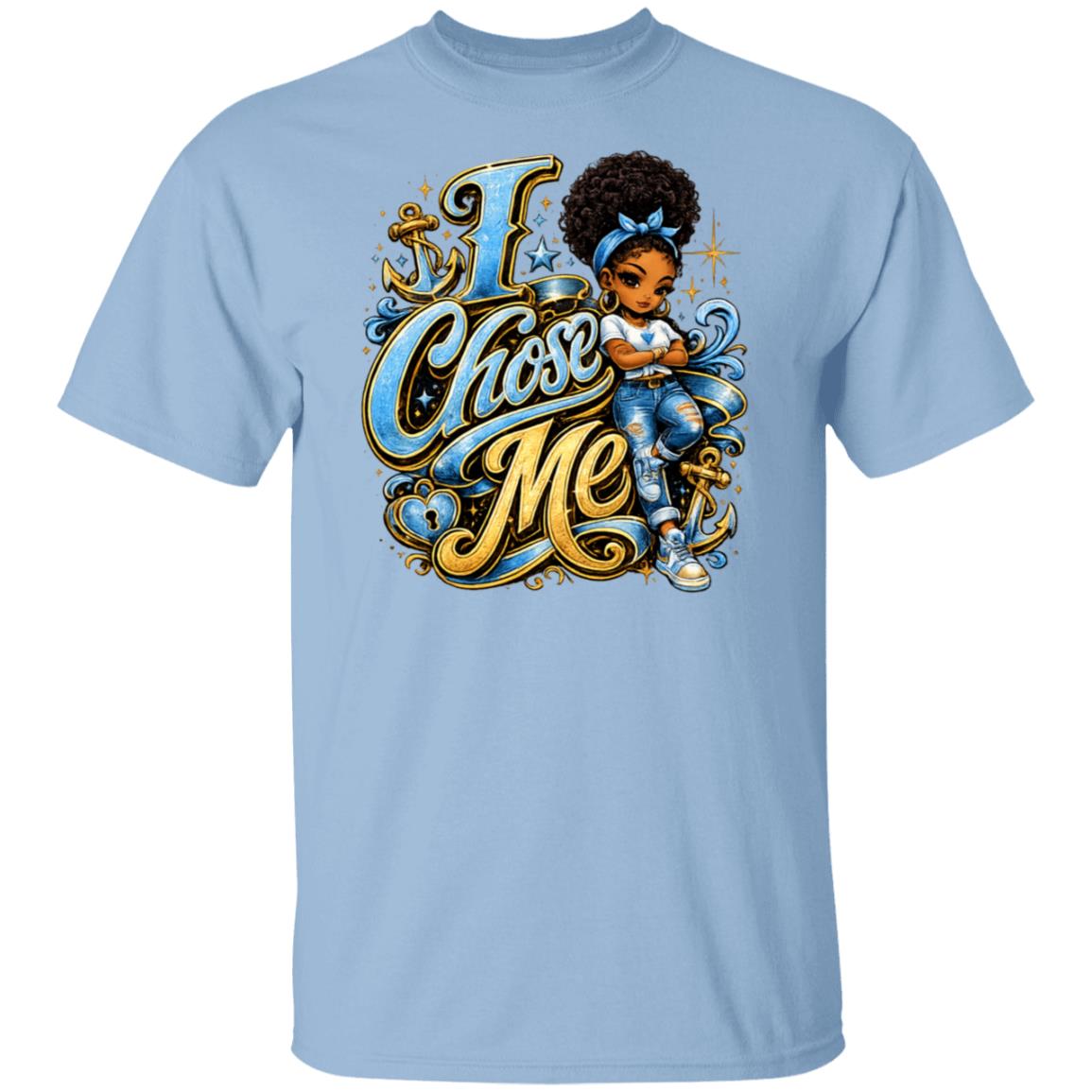 A light blue short-sleeve crewneck t-shirt featuring a colorful graphic print on the front. The graphic displays the text 'I Chose Me' in stylized gold and blue lettering, accompanied by a cartoon illustration of a young girl with an afro hairstyle wearing a blue sailor-style outfit and holding a blue ribbon.
