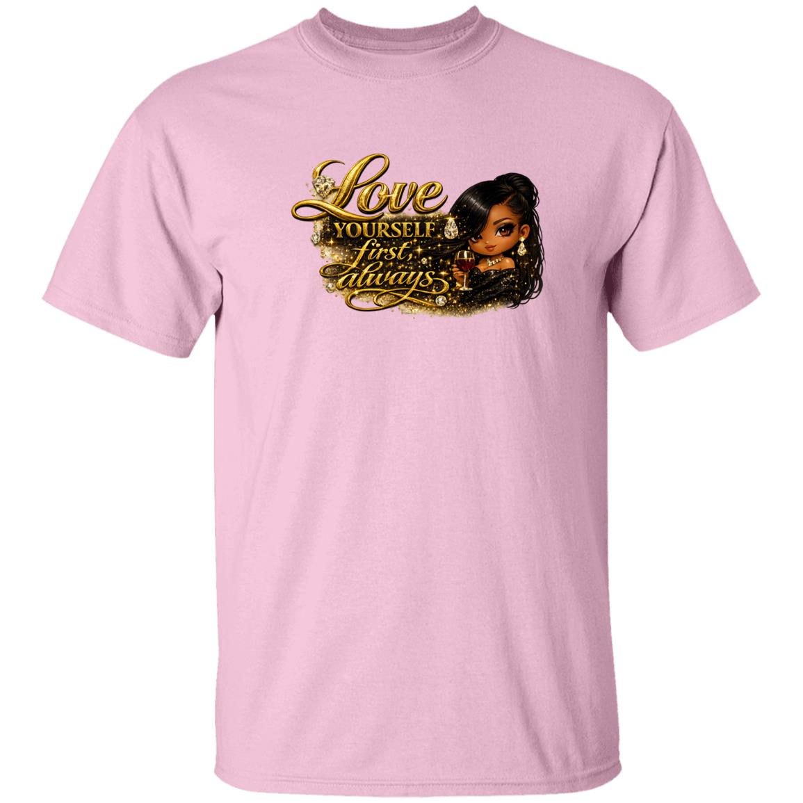 A woman wearing a pink short-sleeve crewneck t-shirt with a graphic print on the front. The graphic features the text 'Love yourself first, always.