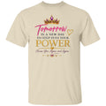 A beige crewneck t-shirt featuring a motivational graphic on the front. The graphic includes a gold crown with purple gemstones, the word 'Tomorrow' in pink script, and the text 'IS A NEW DAY TO STEP INTO YOUR POWER Choose You, Again and Again' in black and gold lettering.