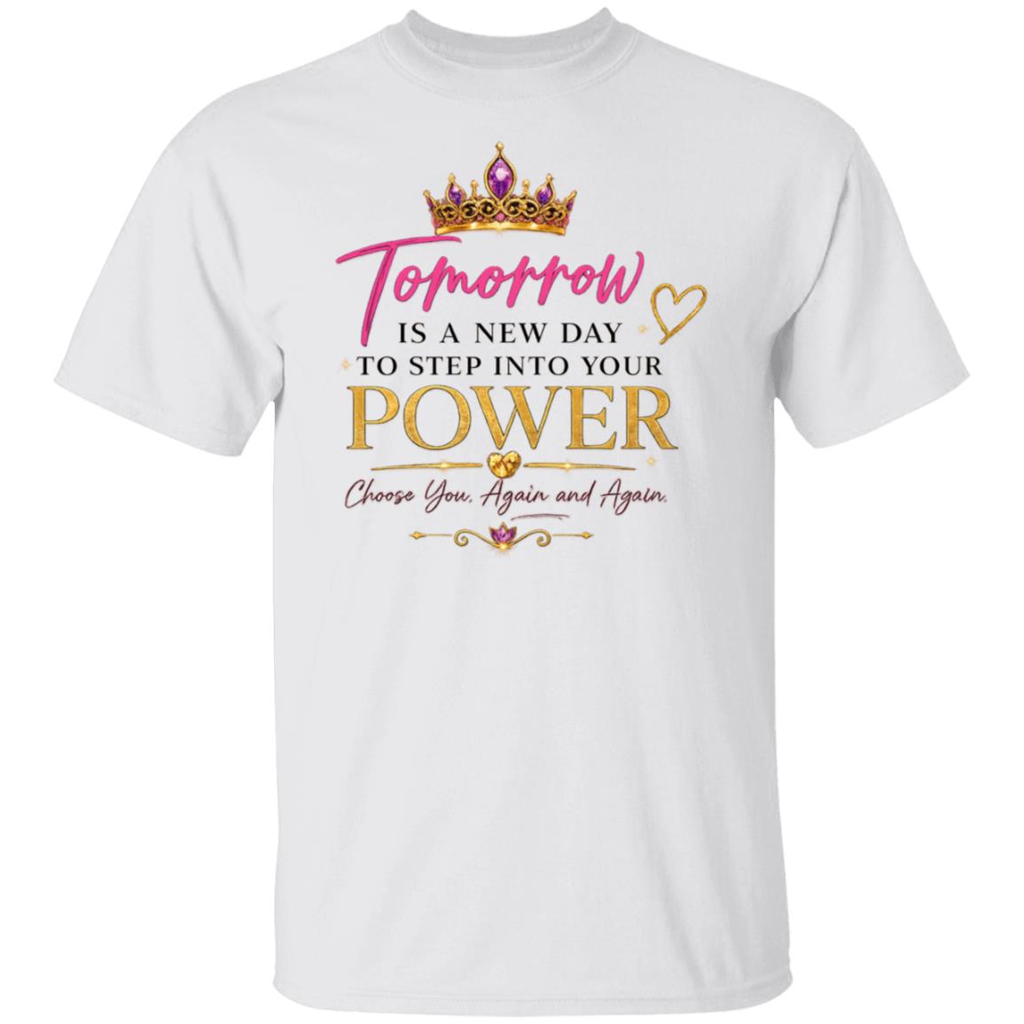 A white short-sleeve crewneck t-shirt featuring a graphic print on the front. The design includes a gold crown with purple gemstones, pink script text reading 'Tomorrow', and black and gold block text reading 'IS A NEW DAY TO STEP INTO YOUR POWER Choose You, Again and Again' with small gold hearts and decorative flourishes.