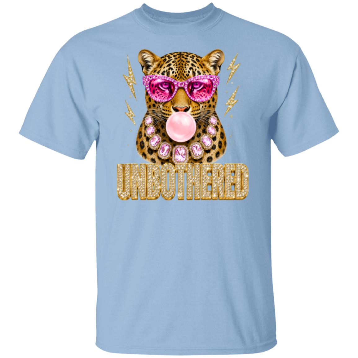 a light blue  graphic tee of a leopard wearing pink sunglasses and a pink bubblegum mouth, with the word 'UNBOTHERED' in gold glitter-style lettering below. 