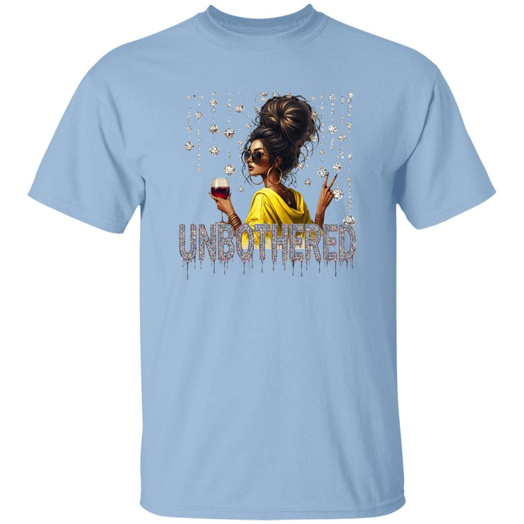 Light Blue graphic t-shirt featuring an 'Unbothered' design with a stylish woman wearing sunglasses, holding a wine glass, flashing a peace sign, and surrounded by sparkling rhinestones