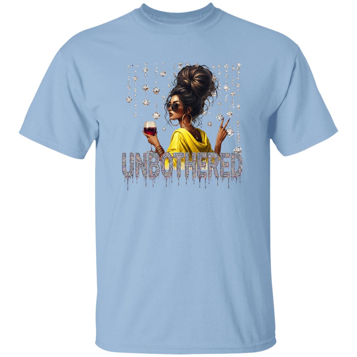 Light Blue graphic t-shirt featuring an 'Unbothered' design with a stylish woman wearing sunglasses, holding a wine glass, flashing a peace sign, and surrounded by sparkling rhinestones