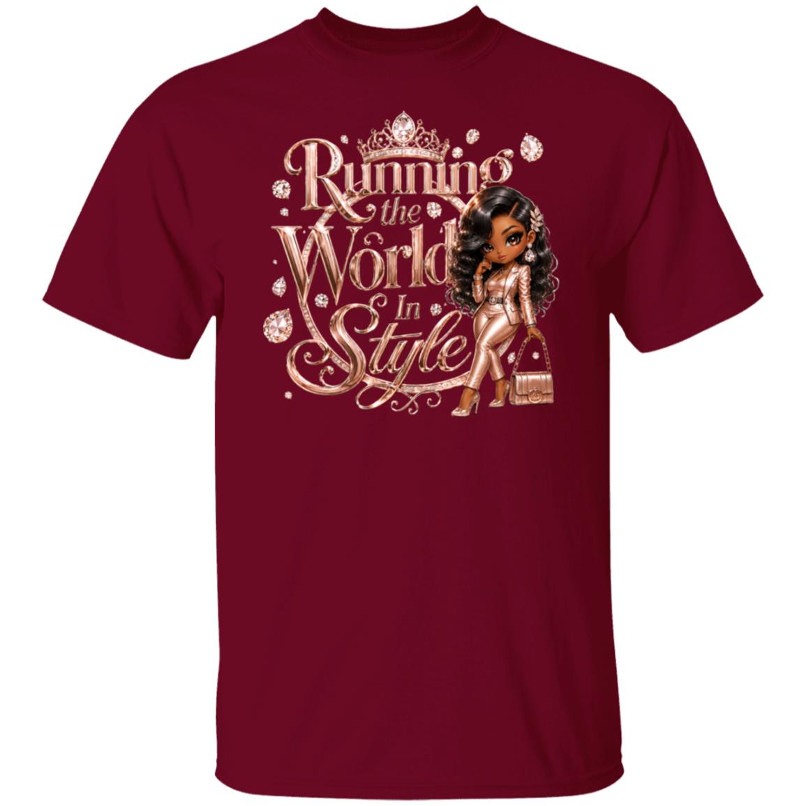 A maroon short-sleeve crewneck t-shirt featuring a graphic print on the front with the text 'Running the World In Style' in a decorative gold font, accompanied by a cartoon illustration of a woman in a gold dress and handbag.